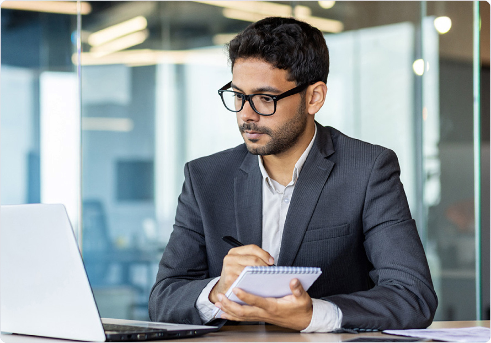 An Orkla India employee working at a laptop during a learning session.