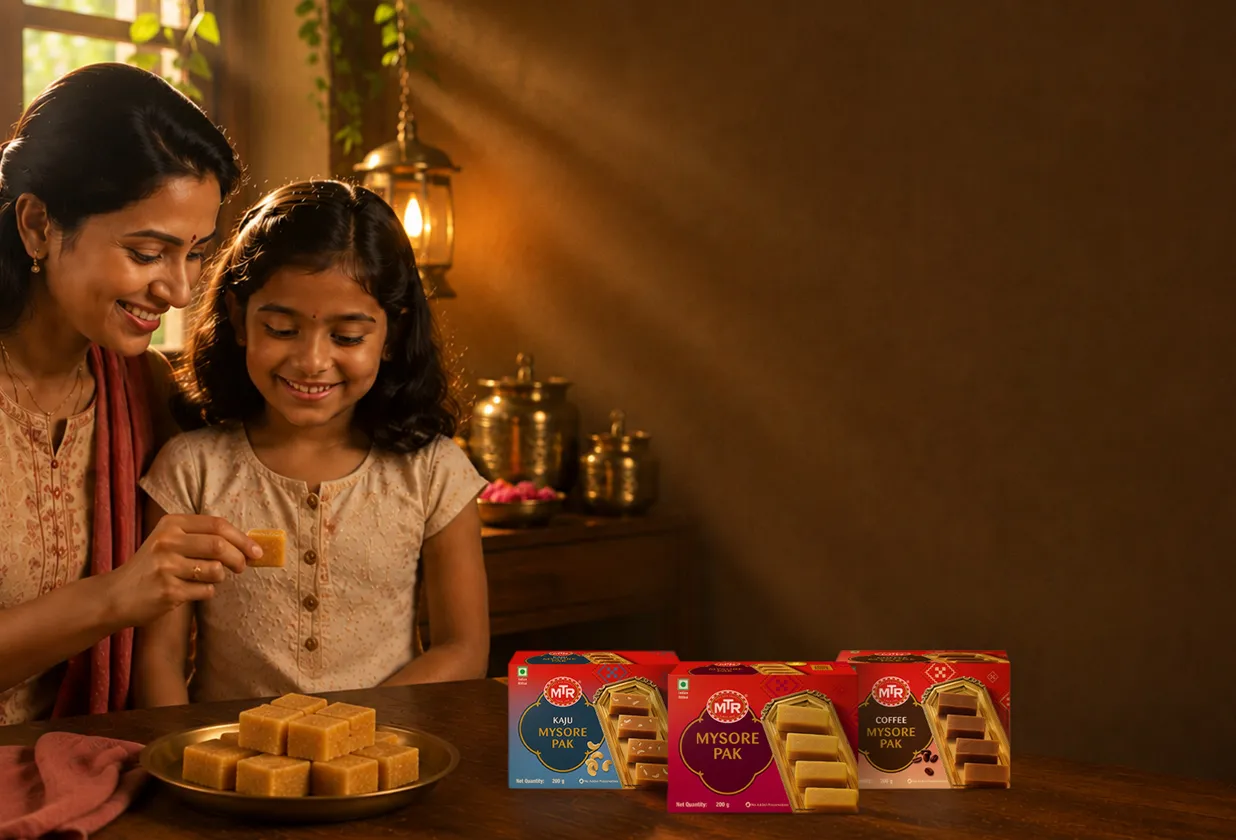 A mother and daughter sharing MTR Mysore Pak